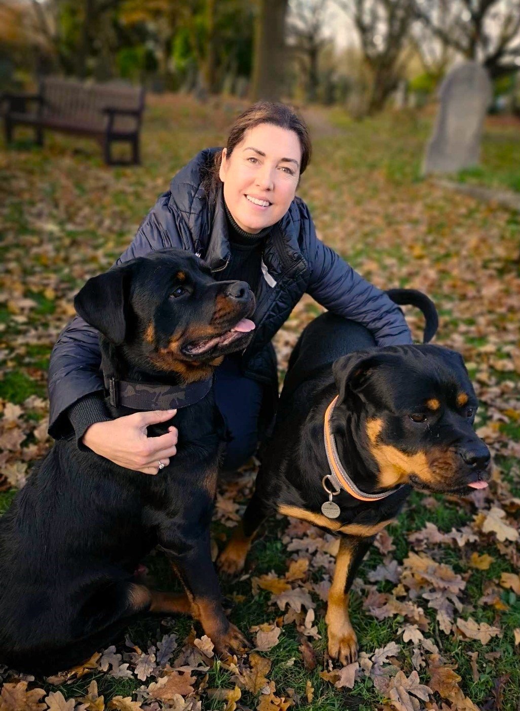 Maria Hartshorn with her two Rottweilers in the park — outside the therapy room